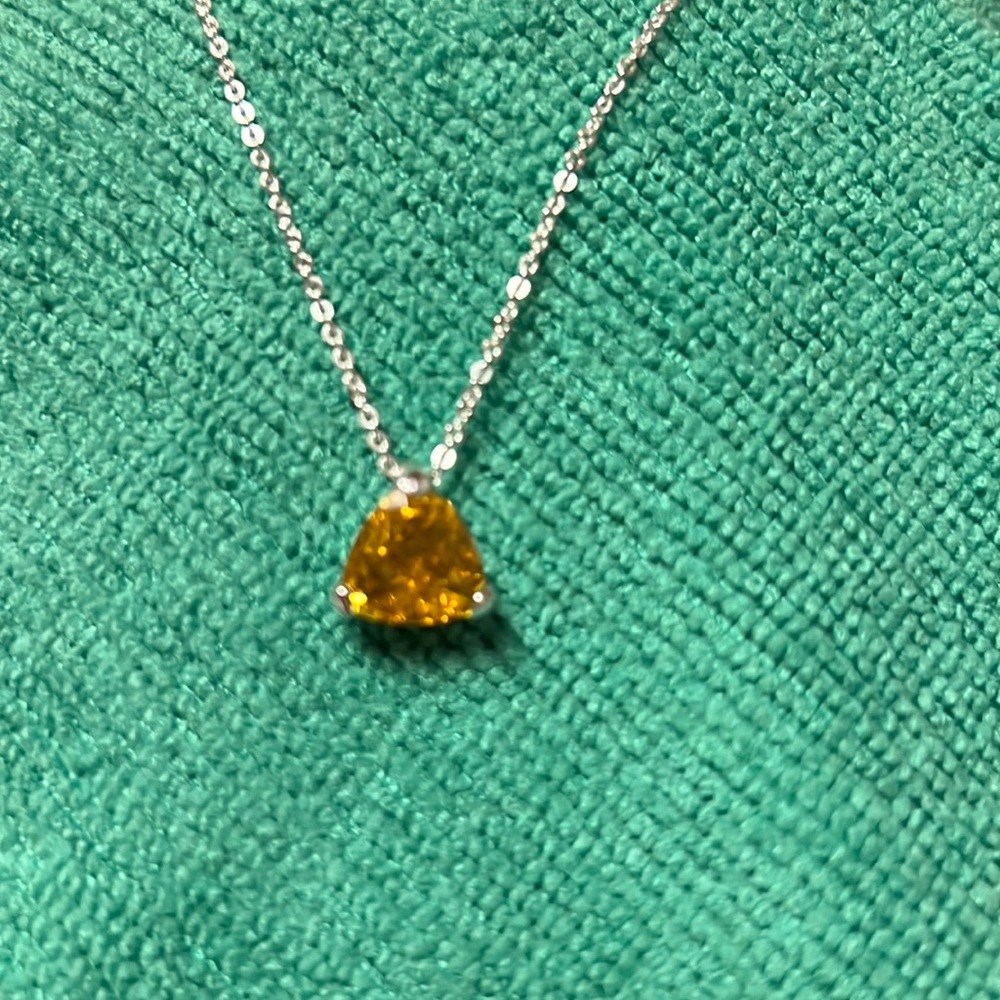 Woman’s 18 inch necklace with yellow stone